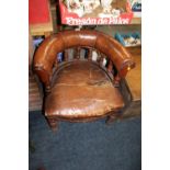 AN ANTIQUE OAK AND LEATHER CAPTAINS TUB ARMCHAIR A/F