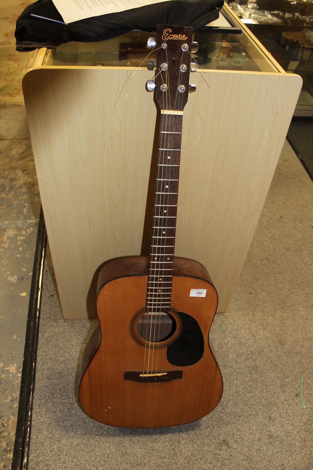 AN ENCORE ACOUSTIC GUITAR