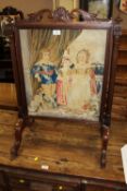 AN EARLY VICTORIAN MAHOGANY AND TAPESTRY EMBROIDERED FIRE SCREEN, the embroidered panel depicting