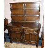 A DARK OAK ERCOL STYLE DRESSER W-122 CM