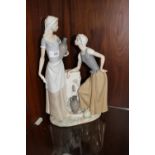 A LARGE NAO FIGURINE OF TWO LADIES COLLECTING WATER, H 39 cm, S/D