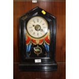A VINTAGE MANTEL CLOCK WITH PAINTED GLASS FRONT OF A PARROT SWINGING ON VASE