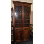 AN ANTIQUE MAHOGANY GLAZED BOOKCASE ON CUPBOARD H-223 W-100 CM A/F