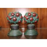 A PAIR OF SMALL CAST METAL DOOR STOPS, IN THE FORM OF FRUIT TREES