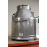 AN ALUMINIUM MILK CHURN