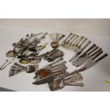 A PART CANTEEN OF SILVER PLATED KINGS PATTERN CUTLERY TOGETHER WITH A BAG OF WHITE METAL CUTLERY