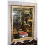 A MODERN GILT RECTANGULAR MIRROR 85 X 59 CM