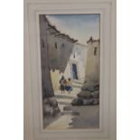A FRAMED AND GLAZED WATERCOLOUR OF A SOUTH AMERICAN VILLAGE SCENE, SIGNED AND DATED LOWER RIGHT