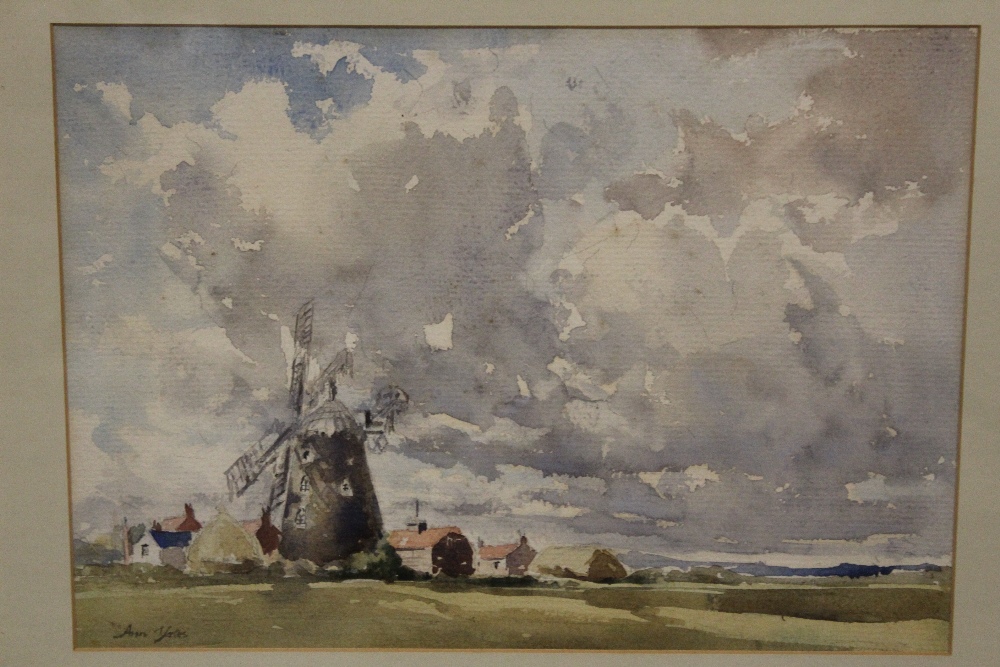 A FRAMED AND GLAZED WATERCOLOUR OF A NORFOLK WINDMILL BY ANN YATES, SIGNED LOWER LEFT, OVERALL