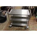A STAINLESS STEEL CATERING TROLLEY