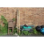 A WHEELBARROW, STRING, BAMBOO STICKS, AND FOUR FOLDING CHAIRS