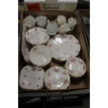 A TRAY OF MAPLE & CO LONDON TEAWARE DECORATED WITH PINK ROSES