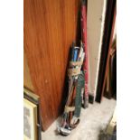 A SELECTION OF GOLF CLUBS, WALKING STICKS ETC