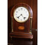 AN EDWARDIAN INLAID MANTEL CLOCK WITH KEY AND PENDULUM