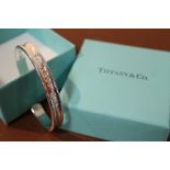 A TIFFANY STYLE SQUARE BANGLE, IN ORIGINAL BOX AND BAG