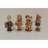 FOUR GOEBEL FIGURES TO INCLUDE A BOY PLAYING A CELLO