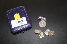 A PAIR OF HALLMARKED SILVER CUFFLINKS TOGETHER WITH A SILVER AND ENAMEL BOW BROOCH WITH A SILVER