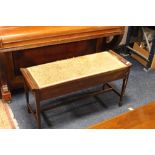 A VINTAGE UPHOLSTERED DUET PIANO STOOL