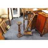 A VINTAGE OAK STICKSTAND WITH FOUR ASSORTED STICKS AND A SMALL TORCHERE (2)