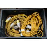 A BOX OF EXTENSION LEADS