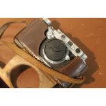 LEICA - A LEATHER CASED ERNST LETZ WETZLIAR D.R.P. H.N.GOVT. CAMERA MODEL NUMBER 163704