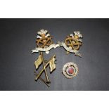 FOUR MILITARY CAP BADGES