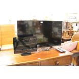 A PANASONIC 39" FLATSCREEN TV - WITH REMOTE AND A SMALL FLATSCREEN TV - WITH REMOTE - HOUSE
