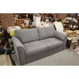 A LARGE MODERN UPHOLSTERED SETTEE