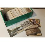 A BOX OF VINTAGE POSTCARDS