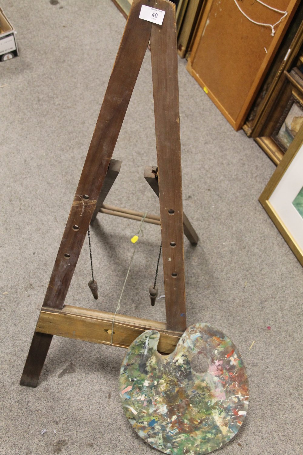 A VINTAGE WOODEN ARTISTS EASEL AND PALETTE (2)