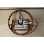 A VINTAGE SPRINGALEX WOODEN STEERING WHEEL TOGETHER WITH A BOX OF VINTAGE STEERING WHEEL HUBS