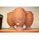 A SET OF THREE PLASTIC TWIN HANDLED PLANT POTS