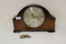 AN OAK CASED TEMPURA MANTEL CLOCK