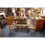 A SET OF FOUR ANTIQUE MAHOGANY AND INLAID UPHOLSTERED CHAIRS