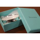 A TIFFANY STYLE BANGLE, IN ORIGINAL BOX AND BAG