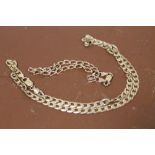 A 9 CT GOLD CURB LINK NECK CHAIN, TOGETHER WITH A 9 CT GOLD FLAT LINK BRACELET, COMBINED WEIGHT 17.5