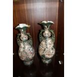 A PAIR OF LARGE VINTAGE GREEN JAPANESE CERAMIC SATSUMA TWIN HANDLED VASES WITH FIGURAL DETAIL