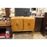 AN UNUSUAL HOMEMADE WALNUT SIDEBOARD / MUSIC CABINET WITH CARVED HARP MOTIFS TO THE DOORS H-106 W-