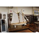 A LARGE WOODEN SCRATCH BUILT POND YACHT ON STAND H-115 W-120 CM
