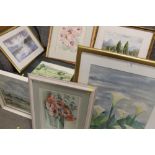 A COLLECTION OF FRAMED AND GLAZED WATERCOLOURS DEPICTING LANDSCAPES AND FLORAL STILL LIFE STUDIES,