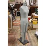 A VINTAGE MANNEQUIN ON STAND