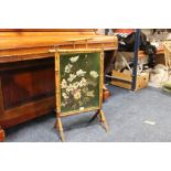 A VINTAGE BAMBOO FIRE SCREEN WITH A GREEN GLAZED FLORAL PANEL H-82 CM