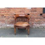 AN ANTIQUE OAK AND LEATHER CAPTAINS TUB ARMCHAIR A/F