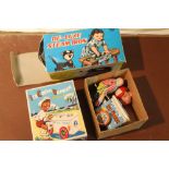 A BOXED TIN PLATE WIND UP ICE CUBE VENDOR TOY TOGETHER WITH A BOXED TOY STEAM IRONER