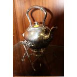 A SILVER PLATED SPIRIT KETTLE ON STAND
