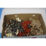 A BOX OF COSTUME JEWELLERY