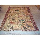 A HAND MADE RUG DEPICTING PREHISTORIC ANIMALS, SIZE 245 X 177 CM