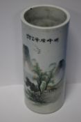 A CHINESE PORCELAIN SLEEVE VASE DECORATED WITH A MOUNTAIN SCENE, WITH BLUE FOUR CHARACTER SEAL TO