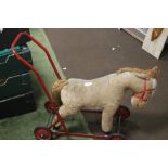 A CHILDS PULL-ALONG HORSE