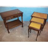 AN INLAID LEATHER NEST OF TABLES AND AN OAK SIDE TABLE WITH TWO DRAWERS (2)